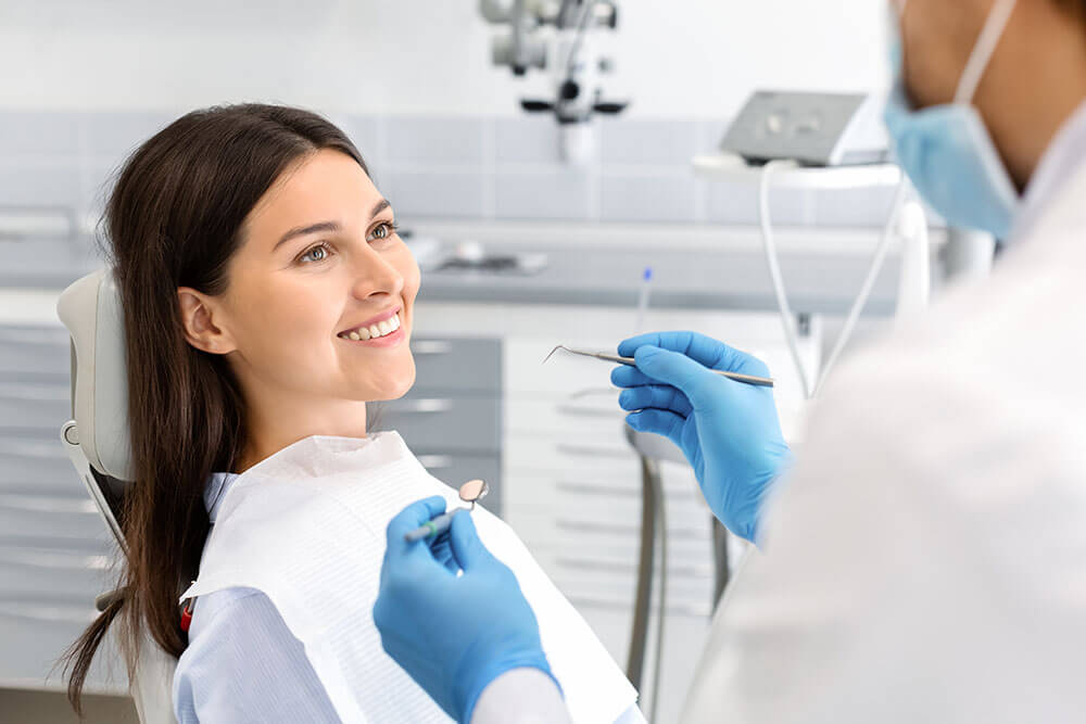 woman smiling in dentist chair